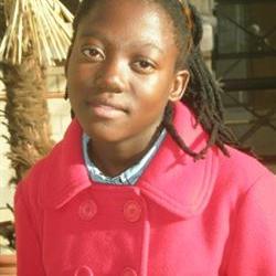 Happy day for Welkom Rastafarian girl