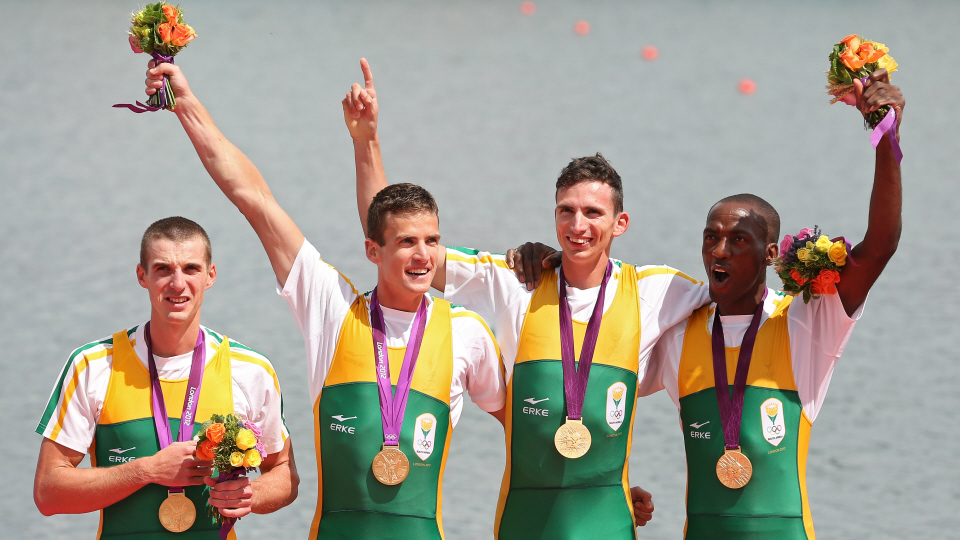 Sizwe Ndlovu, John Smith, Matthew Brittain and James Thompson of South Africa celebrate with their gold medals during the medal ceremony for the Lightweight Men's Four final on Day 6 of the London 2012 Olympic Games - Getty Images