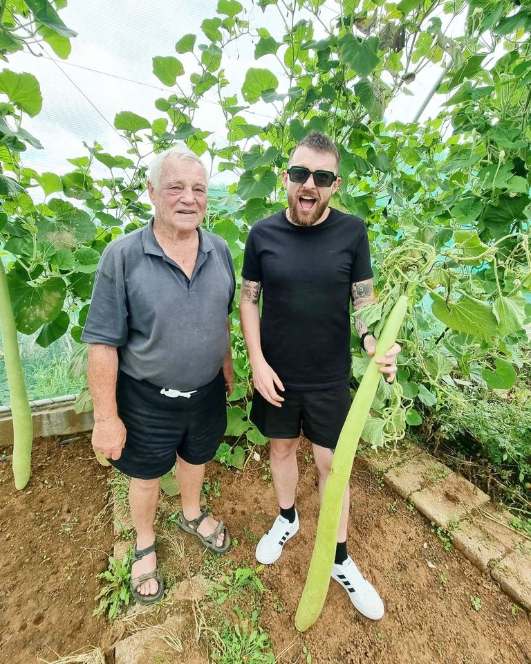 Oom Japie and Shandor Potgieter holding the Snake Squash