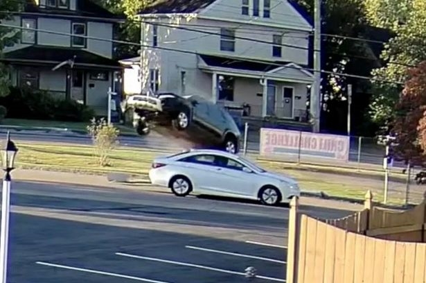 Priest hails 'miracle' after car soars over his roof | News Article
