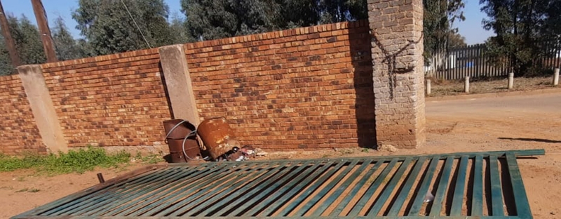 Gate falls onto security guard | News Article