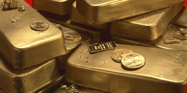 Gold price tumbles to four-year low | News Article