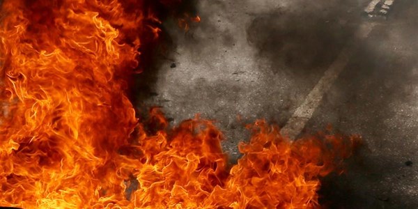 Bankbestuurder-wildboer in veldbrand beseer | News Article