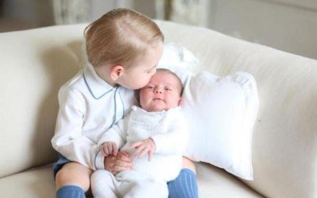Prince George holds Princess Charlotte in first official photo | News Article