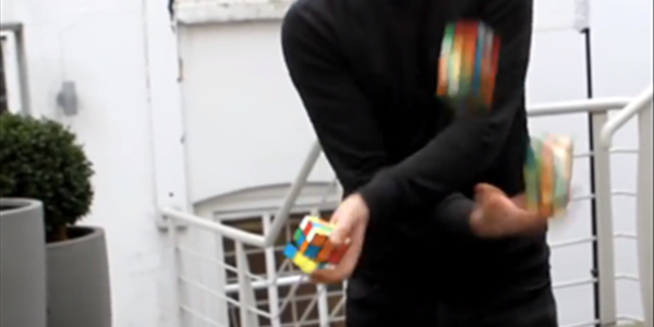 Just a man solving 3 Rubik’s Cubes.  | News Article