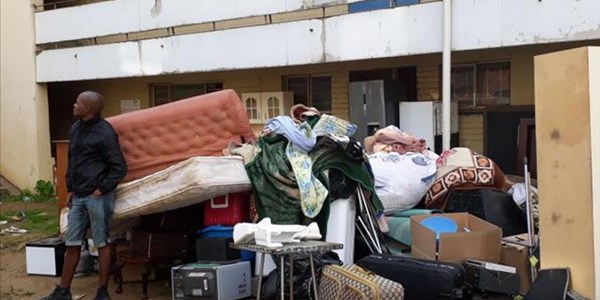 Bloemfontein evictions become heated as belongings are piled in mud | News Article