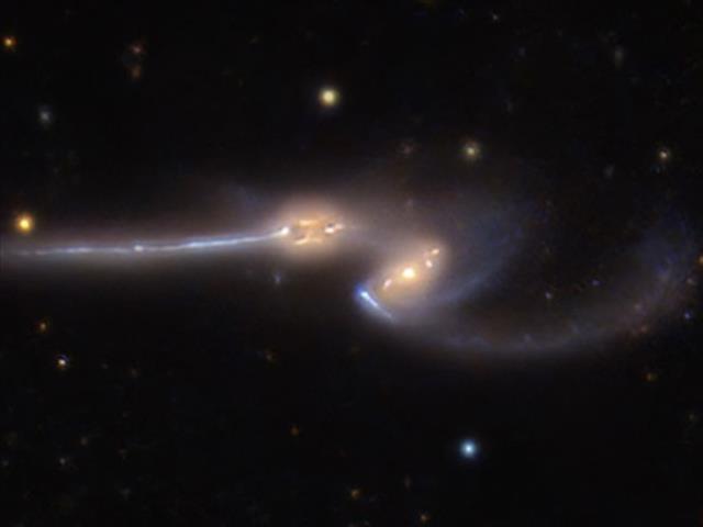 NASA shares incredible picture of two spiral galaxies pulling each other apart | News Article