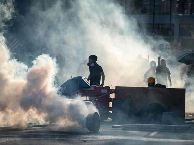 Hong Kong police arrest activists as mass rally is called off | News Article