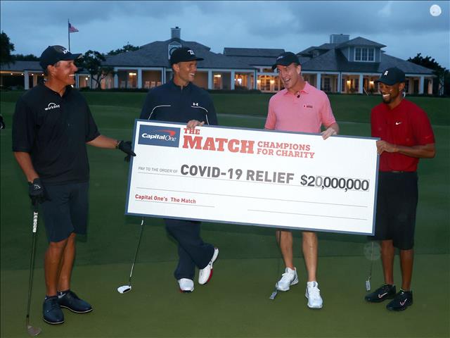 Woods fends off Mickelson in charity match | News Article