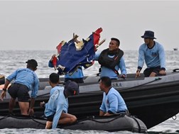 Body parts found at Indonesian plane crash site | News Article