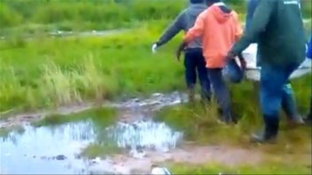Coffin carried far due to muddy roads - VIDEO | News Article