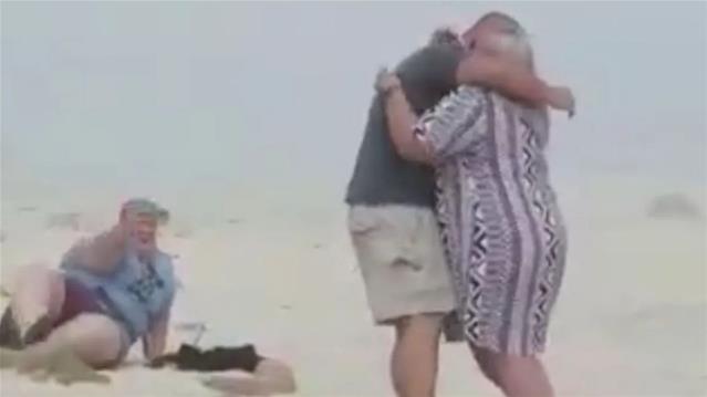 WATCH: Sister falls thrice but gets the shot in viral beach proposal video | News Article